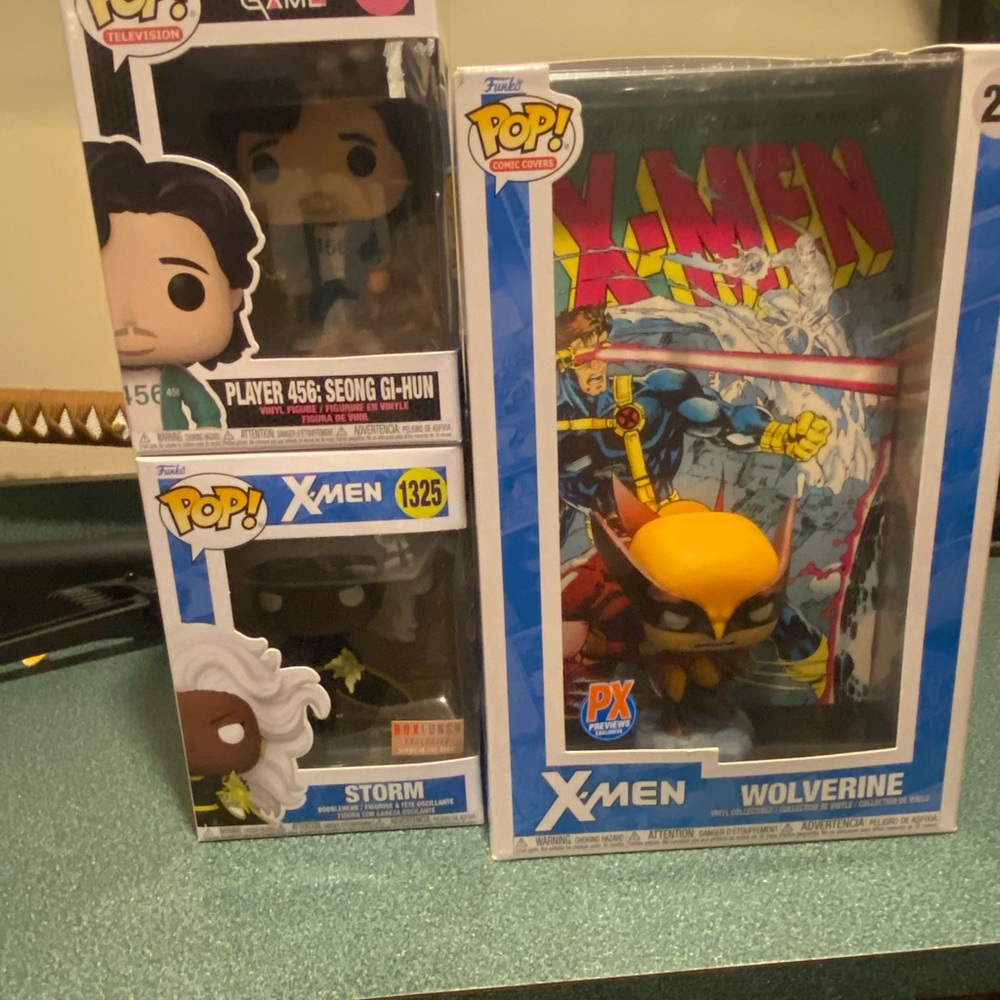 Funko Pop! X-Men Wolverine and Storm Figures - Blue and Yellow